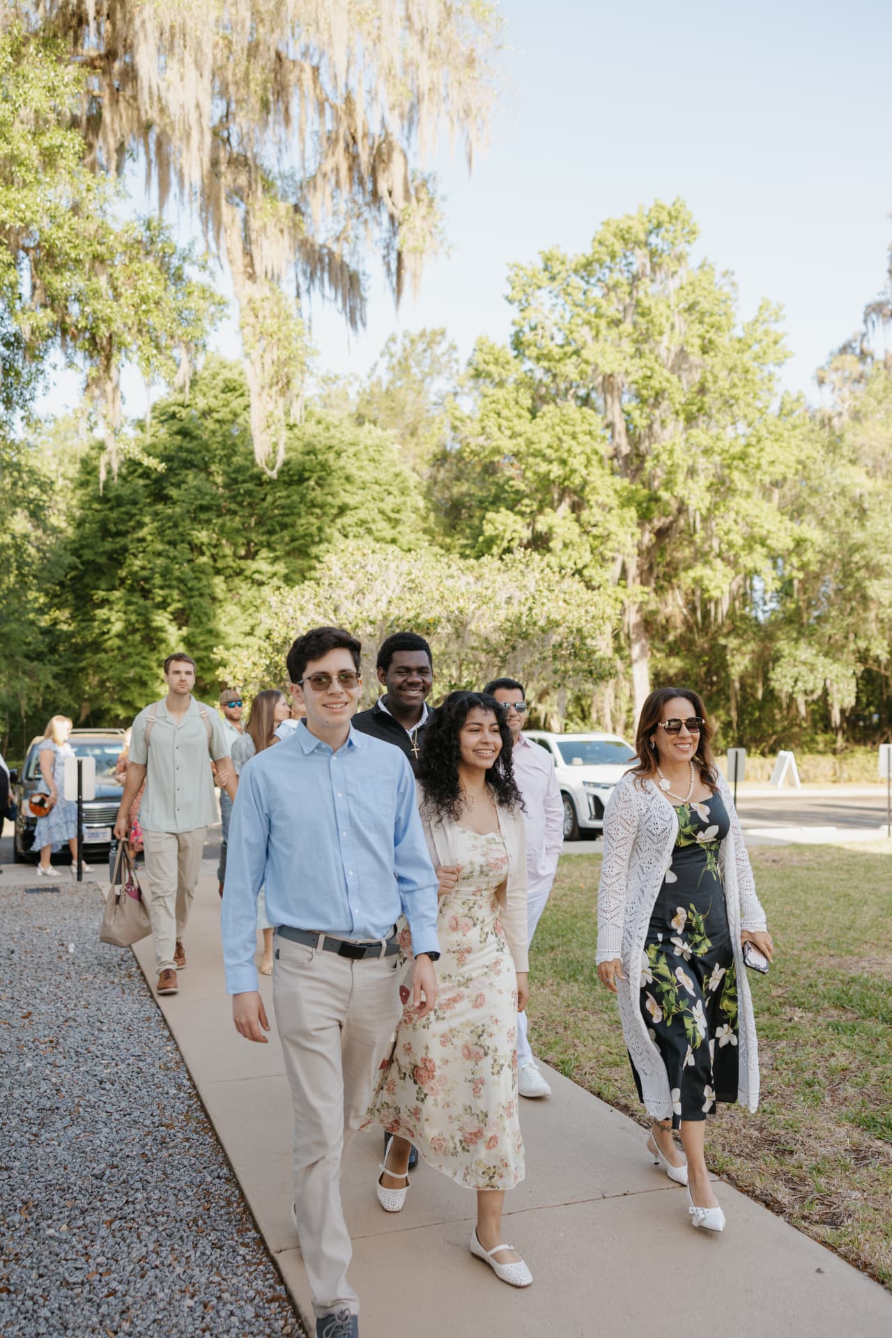 People walking up the sidewalk into Salt Church on a Sunday morning