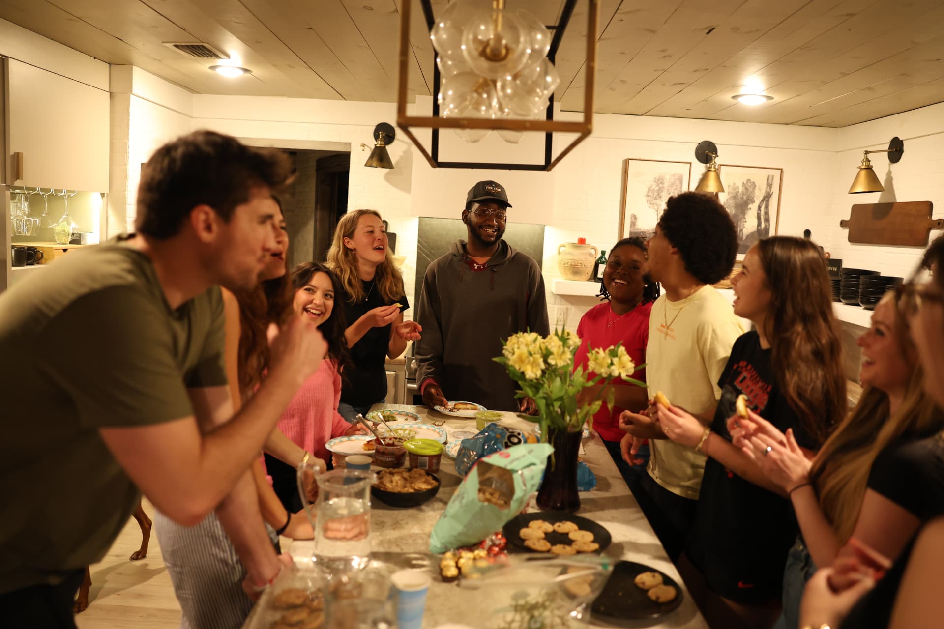A Salt Church Connection Group laughing together around a table full of food