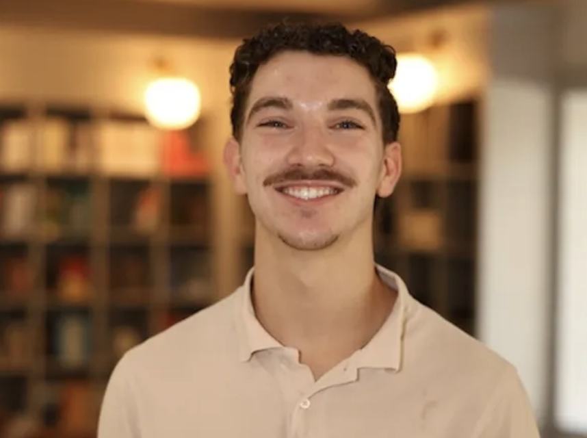 Garrett, Salt Youth director, smiling in the church lobby